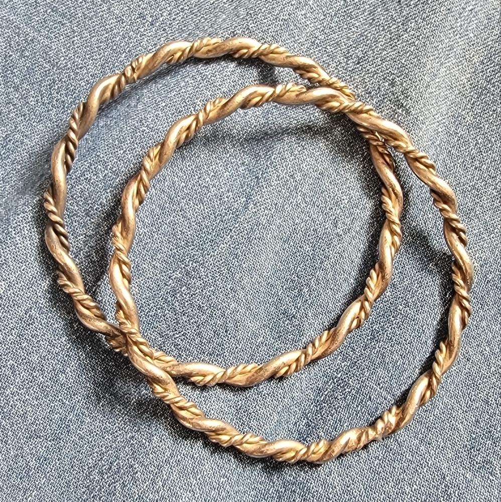 Pair of silver twist bangles. Braid design. Good condition. Nice weight.